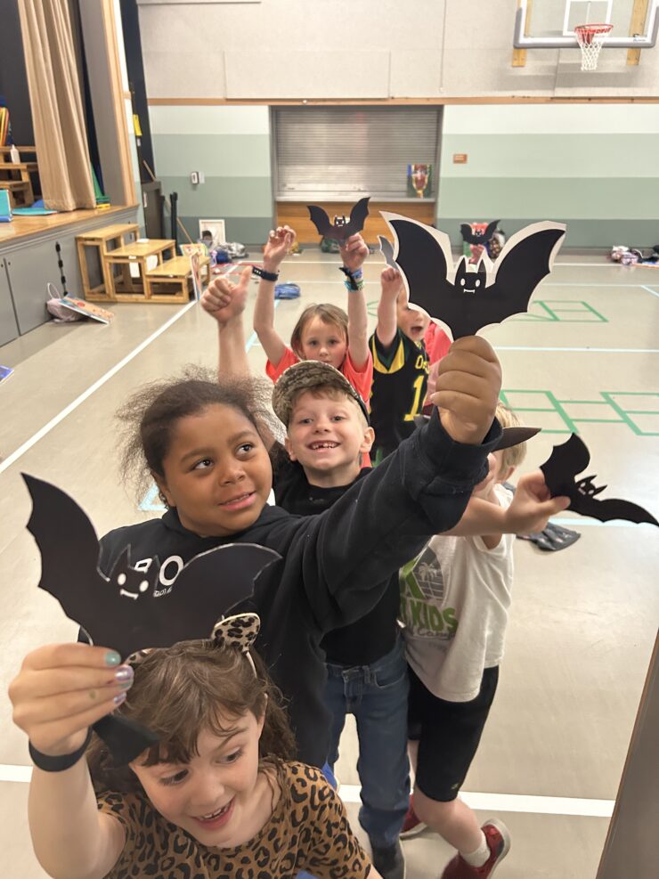 Kids holding their bat art projects
