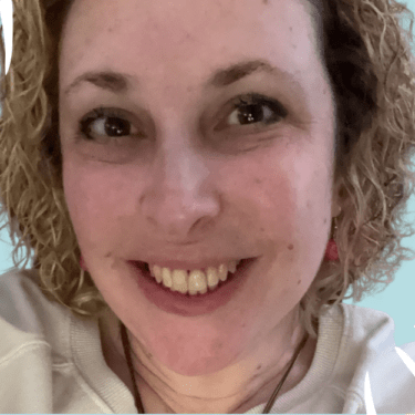 Picture of Jacque Coleman with a bright background.