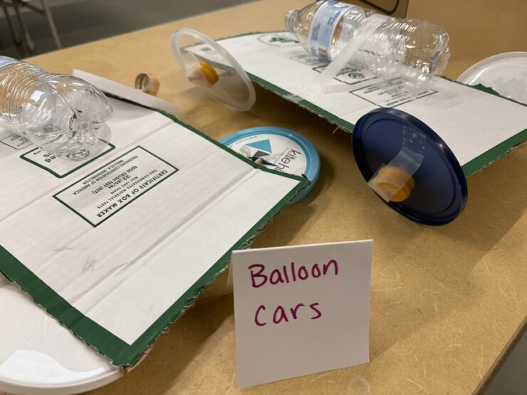 Balloon cars made from recycled materials.