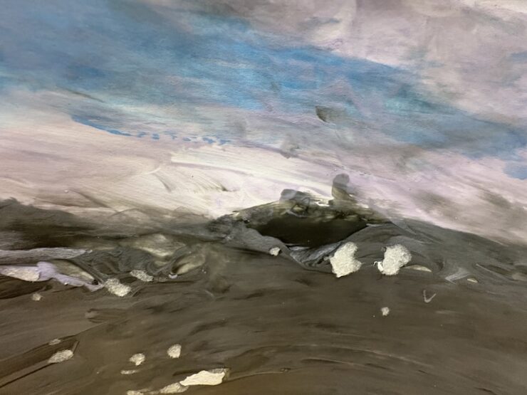 Painting with blue, white and black all blending together.