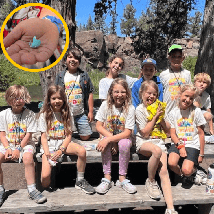 Picture of campers and a hand holding a bird egg.