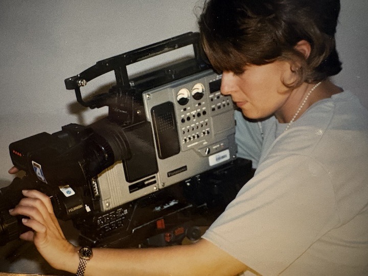 Katie Roberts using a tv camera.