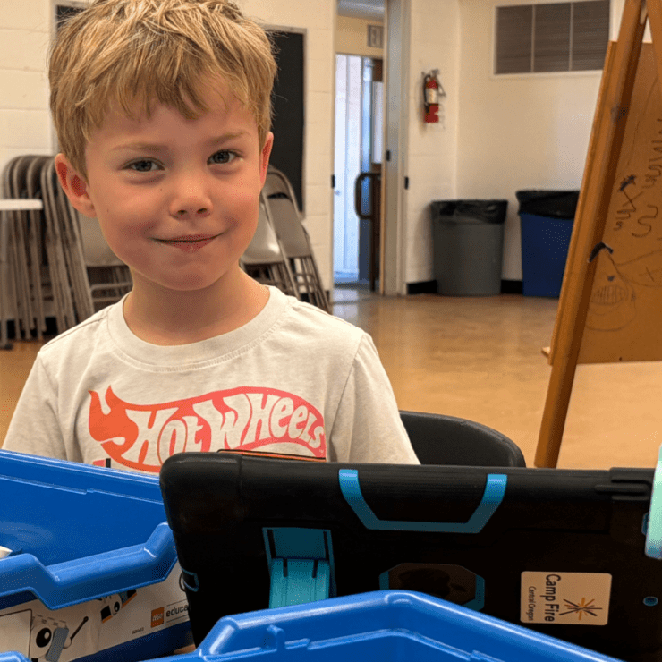 Boy doing robotics coding.