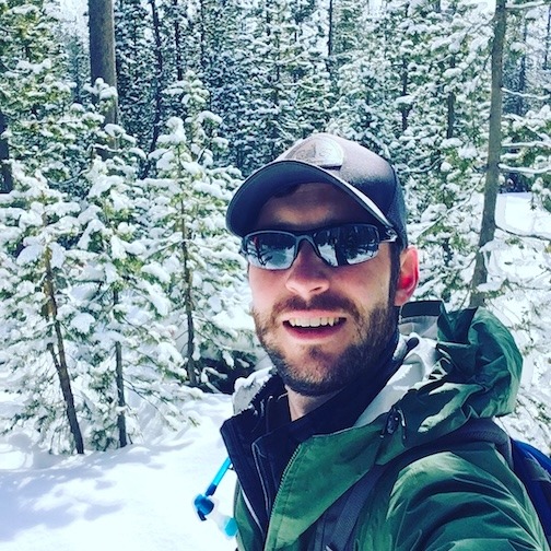 Jesse Flury photo with a snowy wooded background
