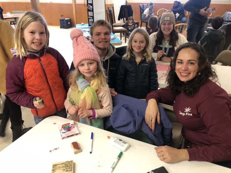 Camp Fire staff member and group of No School Day Campers make Valentines Day cards for U.S. Veterans