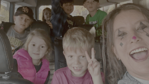 Jen Paynter in a van with a carload of Camp Fire Afterschool kids on a field trip.