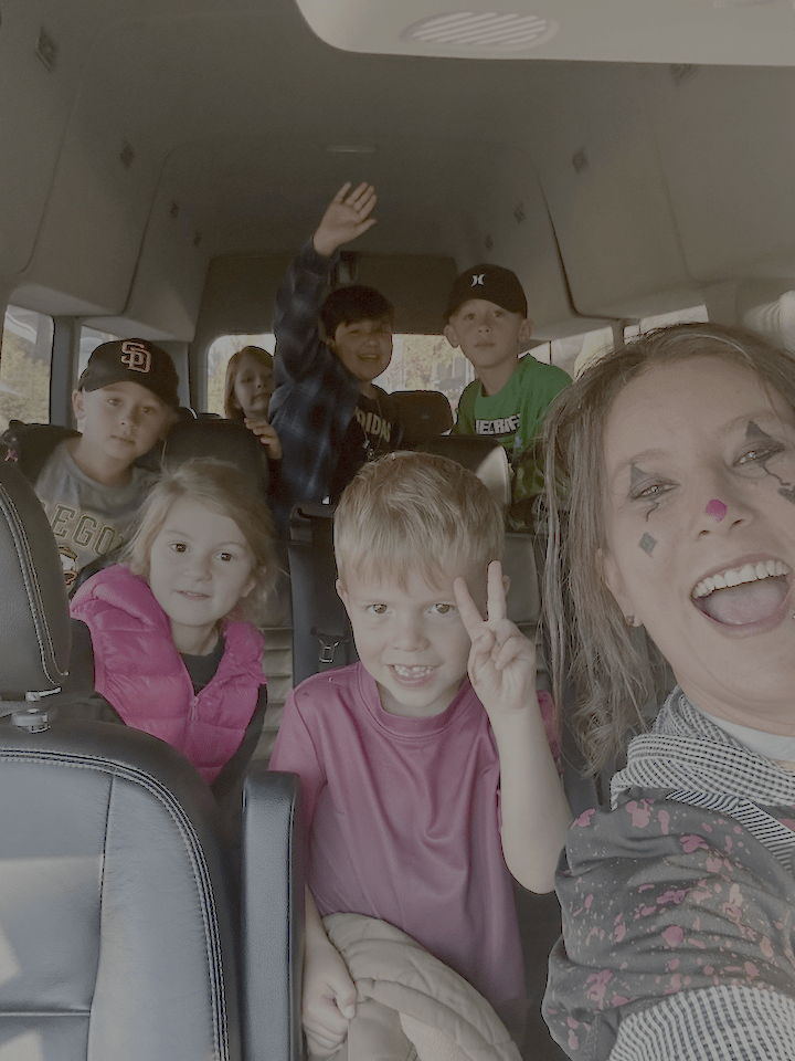 Jen Paynter in a van with a carload of Camp Fire Afterschool kids on a field trip.
