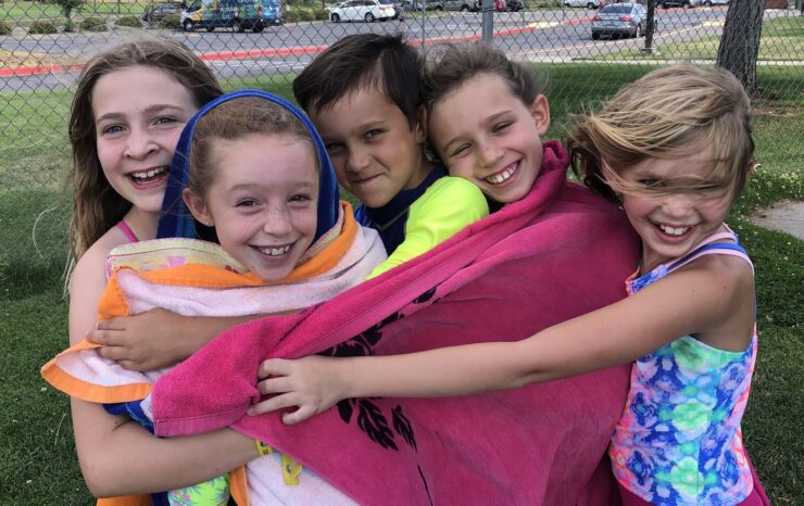 SummerKids youth hugging